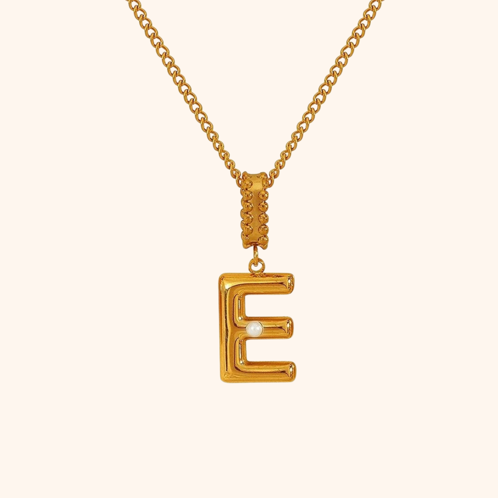 Gold letter E necklace with delicate pearl detail